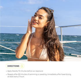 Raw Elements tin on beach towel conveying reef-safe, outdoor use