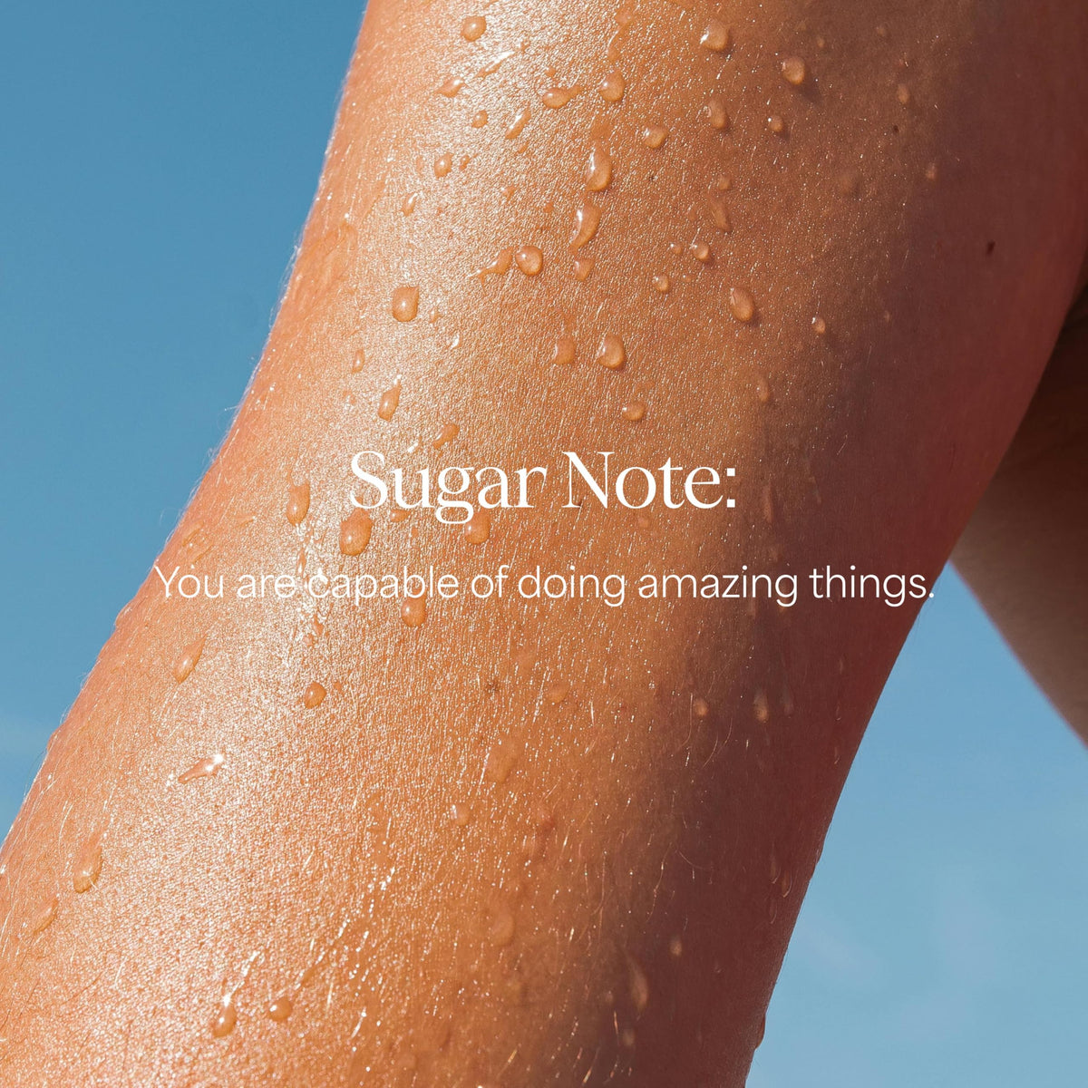 RAW SUGAR lifestyle scene in bathroom with tropical props conveying uplifting fragrance benefit