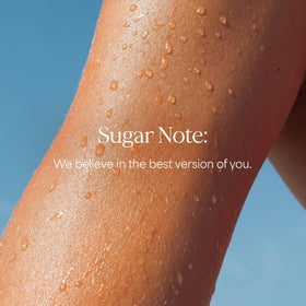 RAW SUGAR bottle held in hand showing 20 fl oz scale and portability