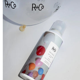 R+Co styling in salon demonstrating instant volume and professional finish