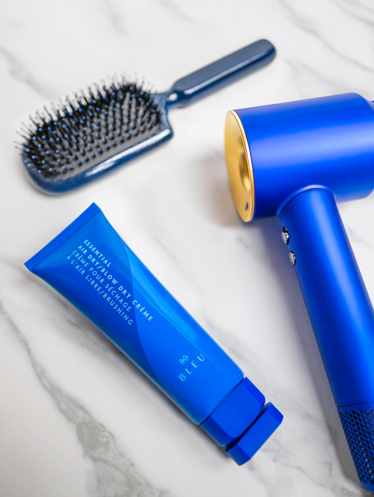 R+Co BLEU used during blow‑dry process delivering smoother, shinier hair