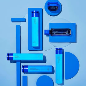 R+Co BLEU bottle in hand for scale and portable styling convenience
