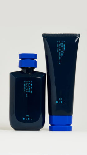 R+Co BLEU conditioner texture being dispensed showing creamy slip that detangles strands