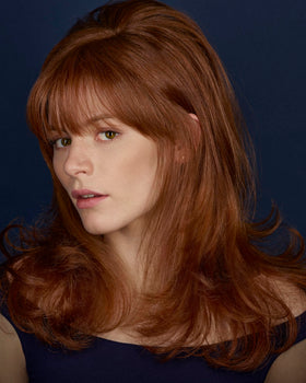 R+Co BLEU lifestyle image of blow-dry use illustrating smooth, frizz-resistant finished hair