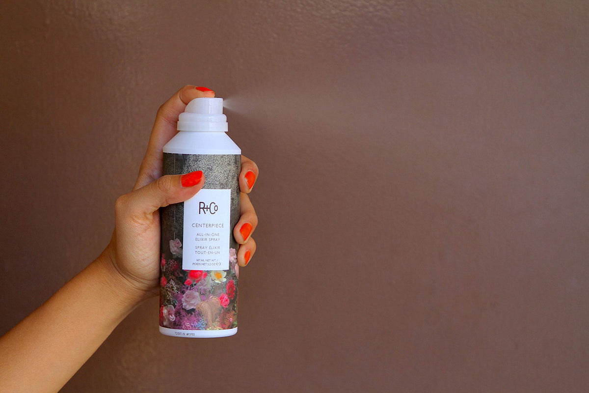 R+Co Centerpiece being sprayed on damp hair to help detangle and smooth