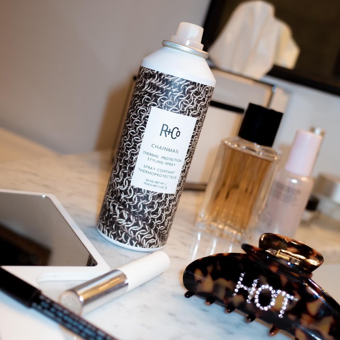 R+Co Chainmail texture sprayed on hair illustrating heat protection and flexible hold