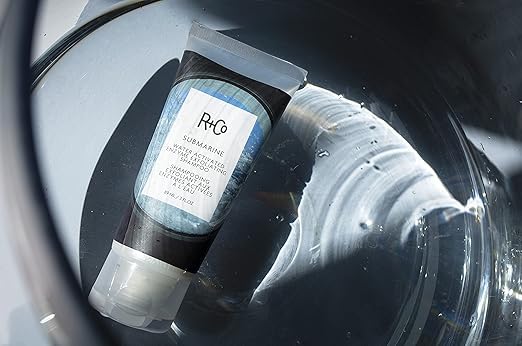 R+Co Cool Wind deluxe sample beside full-size to illustrate travel-friendly convenience and trial use