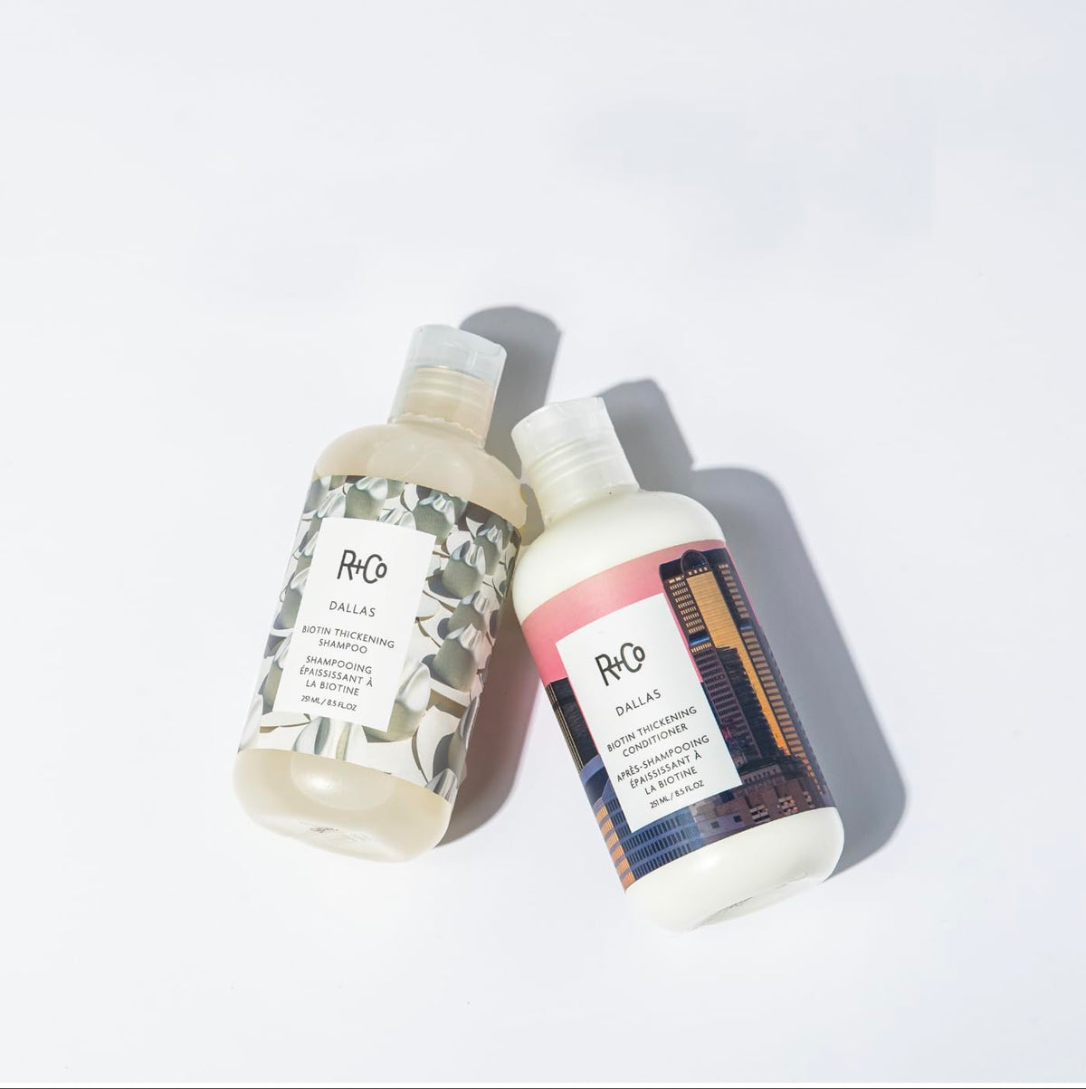 R+Co Dallas being worked through wet hair in shower for detangling and slip benefit