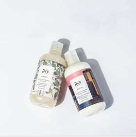 R+Co Dallas being worked through wet hair in shower for detangling and slip benefit