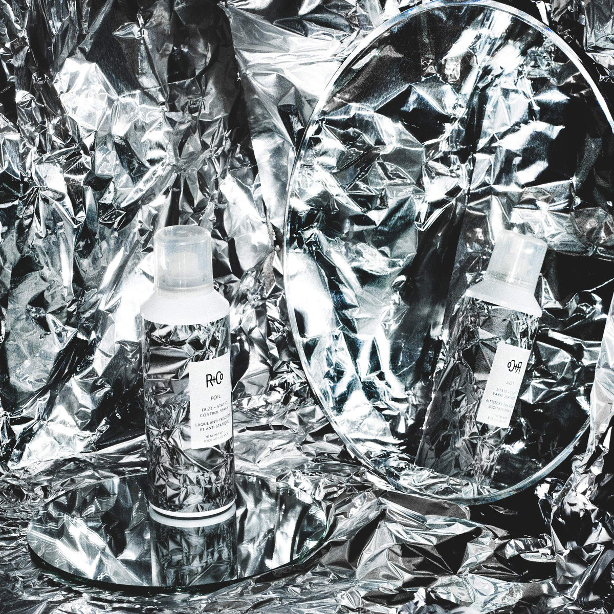 R+Co Foil in use during blowdry to tame flyaways and protect hair from heat