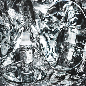 R+Co Foil in use during blowdry to tame flyaways and protect hair from heat