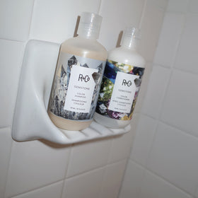 R+Co Gemstone bottle in bathroom setting for salon-quality shine benefit