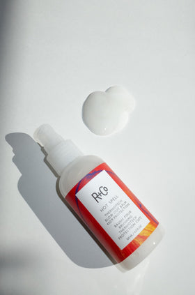 R+Co Hot Spell balm texture closeup demonstrating silky transformation and smoothness