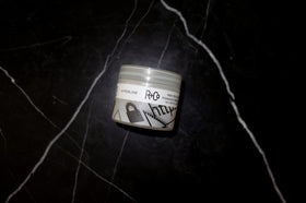 R+Co Hyperlink pomade in hand demonstrating easy spreadability and control