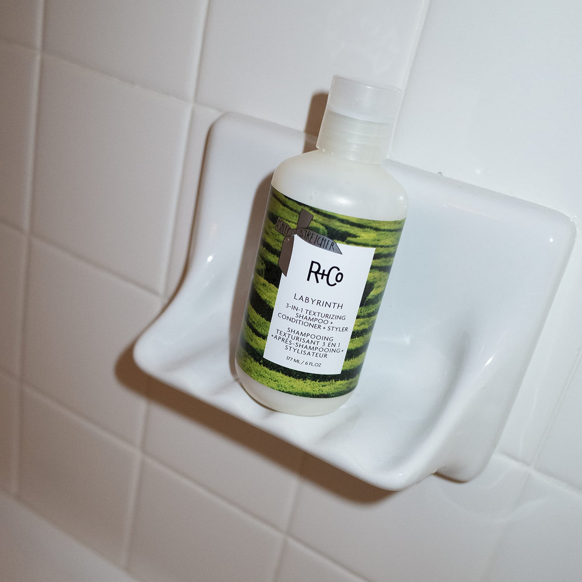 R+Co Labyrinth foam texture in hand illustrating lightweight lather and easy spreadability