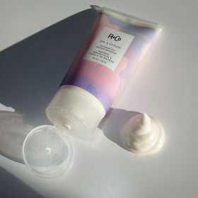 R+Co applying masque to wet hair demonstrating improved manageability