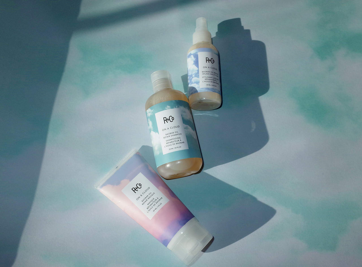 R+Co shampoo styled on bathroom shelf conveying luxe routine benefit