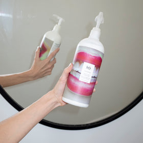 R+Co Television conditioner pump top close-up for easy dispensing benefit