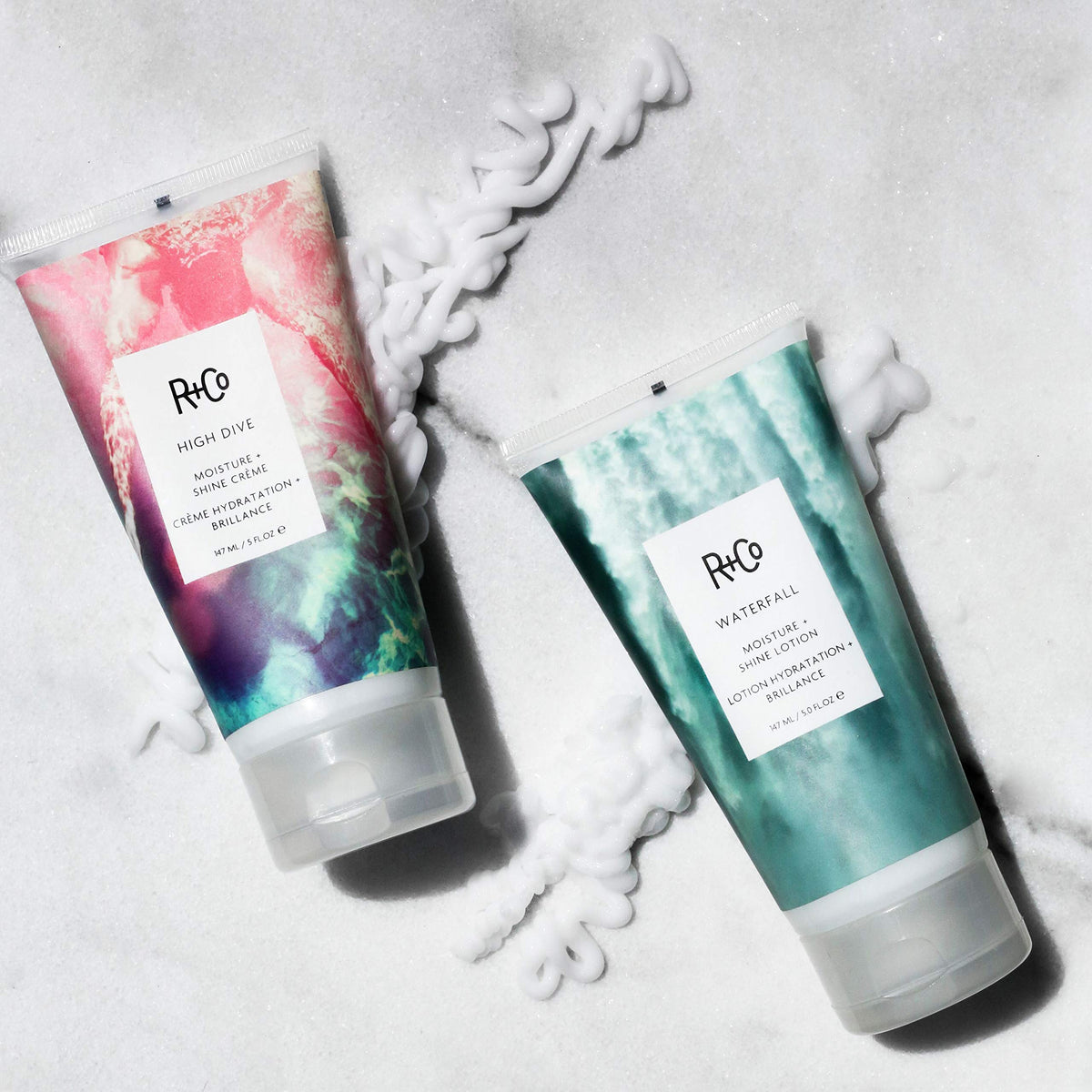 R+Co Waterfall bottle next to hand showing 5 fl oz scale for size and portability
