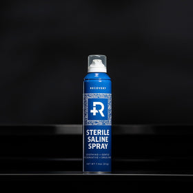Recovery Aftercare spray in hand illustrating easy application