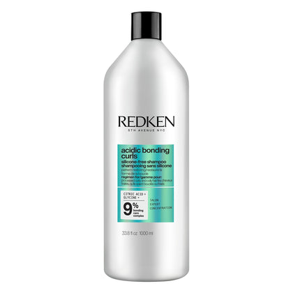 Redken product front packaging showing brand and repair benefits
