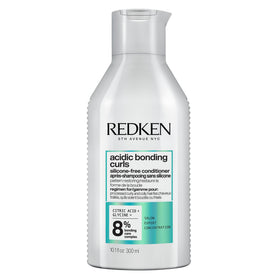 Redken product front packaging showing conditioner and benefits