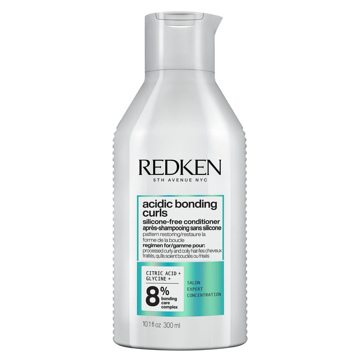 Redken product front packaging showing conditioner and benefits