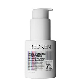 Redken front bottle shot showing product and benefit of daily repair