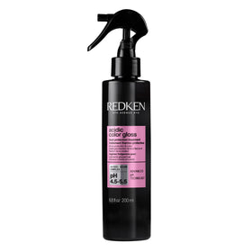 Redken bottle front packaging showing product benefits and sleek design