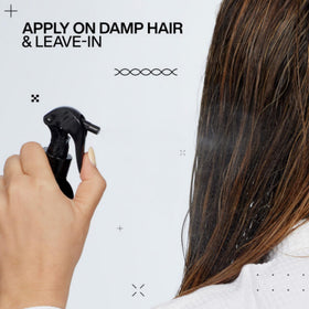 Redken product on vanity during styling illustrating boosted shine and manageability