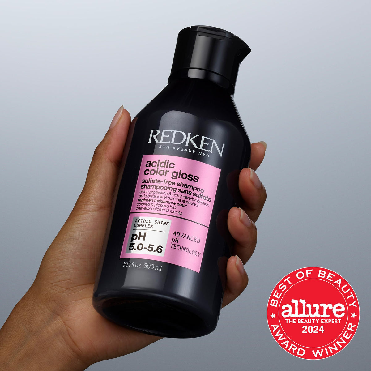 Stylist applying Redken shampoo in salon demonstrating professional finish benefit