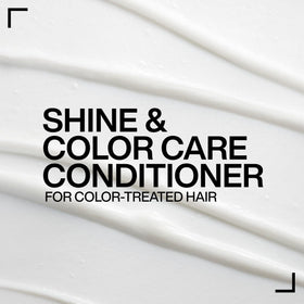 Redken bottle beside hand for size comparison and clear indication of product amount