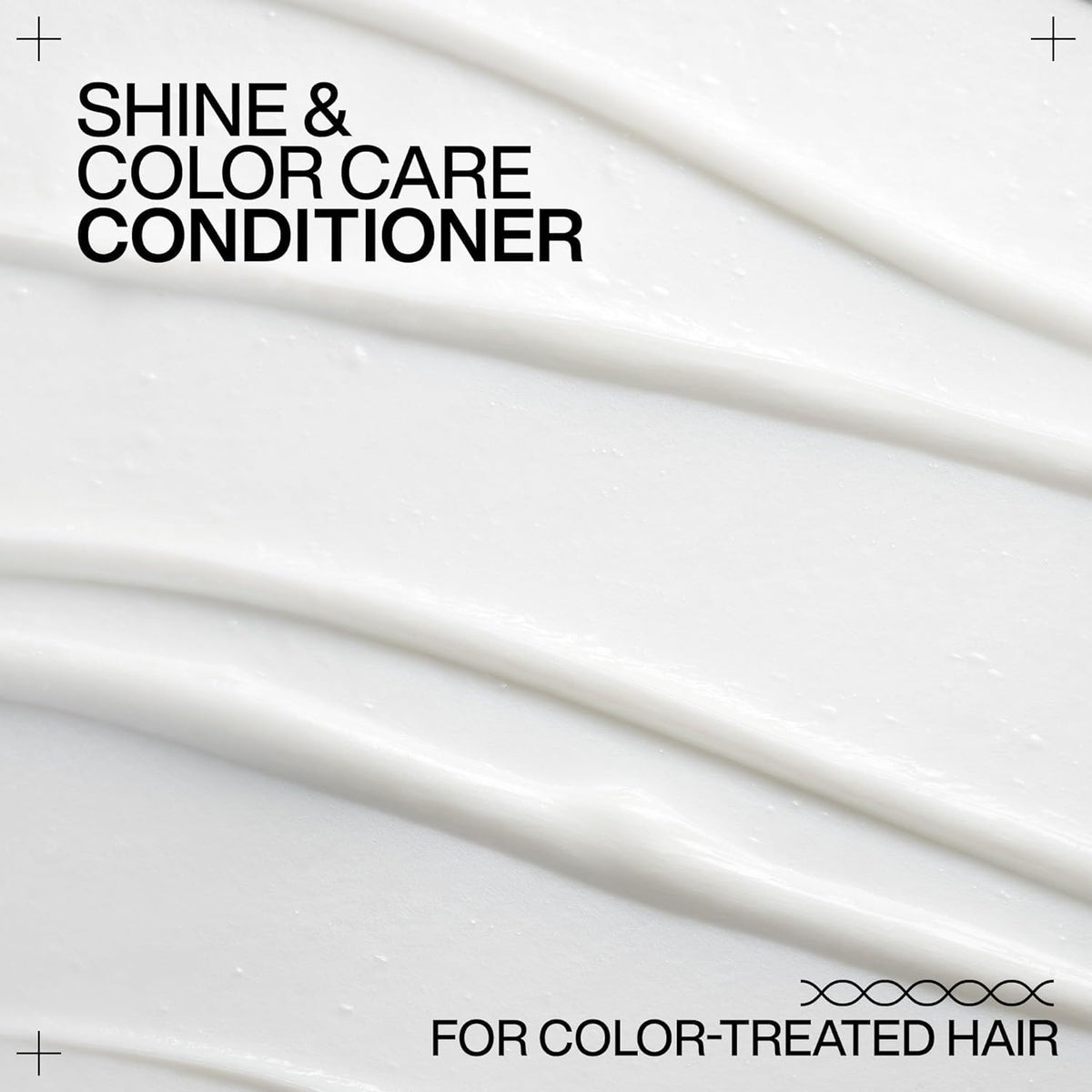 Redken conditioner on bathroom shelf in styled setting, showcasing salon shine
