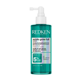 Redken bottle front packaging showing product benefits and branding