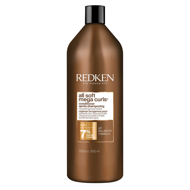 Redken front bottle showing product and volume with clear branding and benefit