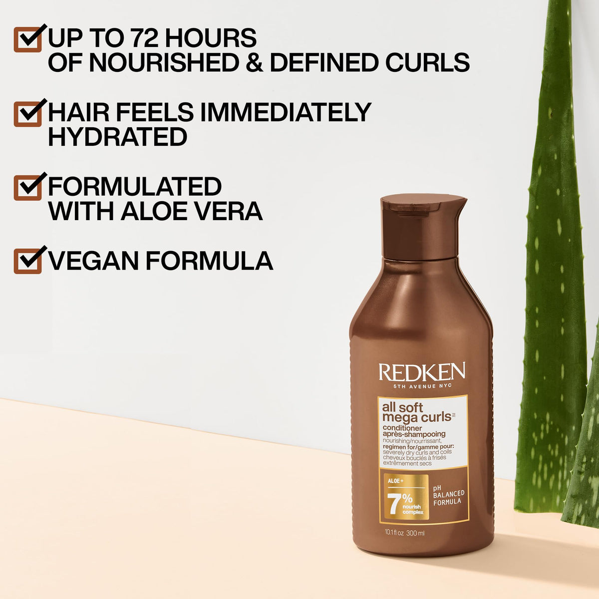 Redken All Soft Mega Curls conditioner texture poured to show creamy moisture-rich formula