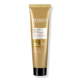 Redken travel bottle front view showing brand and travel convenience