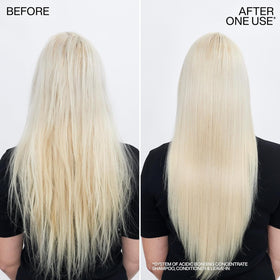 Redken conditioner being applied to mid-lengths for reconstructed strength