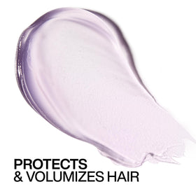 Redken in a salon-like blowdry setting delivering frizz control