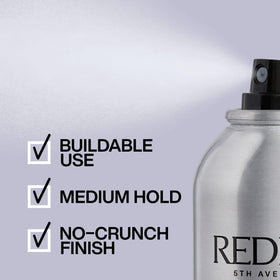Stylist applying Redken to curly hair to define curls and reduce frizz benefit