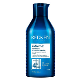 Redken Extreme Conditioner front bottle showing branding and size, promoting repair