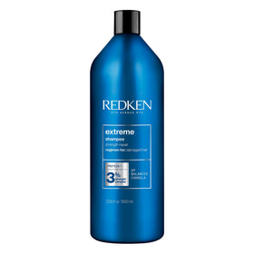 Redken front bottle view showing brand and repair-focused label benefits