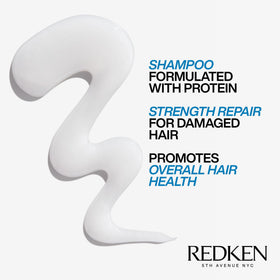 Redken bottle staged in a bathroom showing repair routine convenience