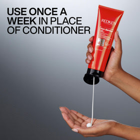 redken Frizz Dismiss mask being applied to damp hair showing better detangling and manageability