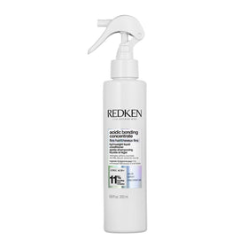 Redken front packaging showing bottle and brand for clear product identification and trust
