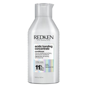 Redken front packaging showing bottle and product benefit for repair
