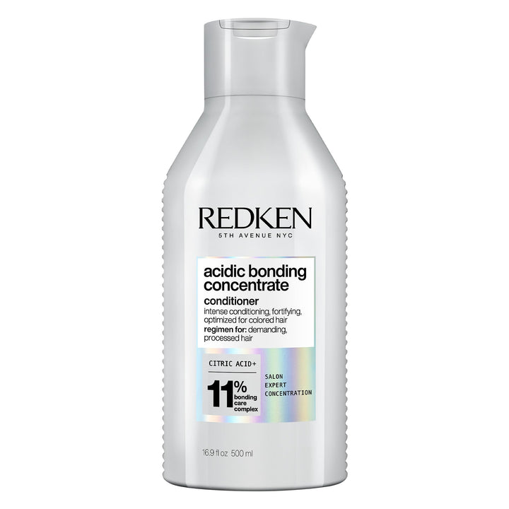Redken front packaging showing bottle and product benefit for repair