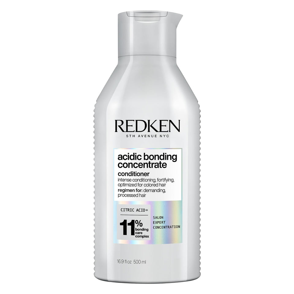 Redken front packaging showing bottle and product benefit for repair