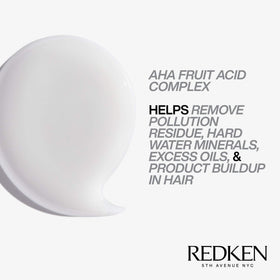 Redken bottle beside ruler showing 33.8 fl oz size for value