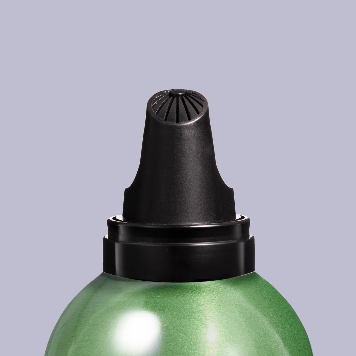 Redken product held in hand to show scale and travel-friendly benefit